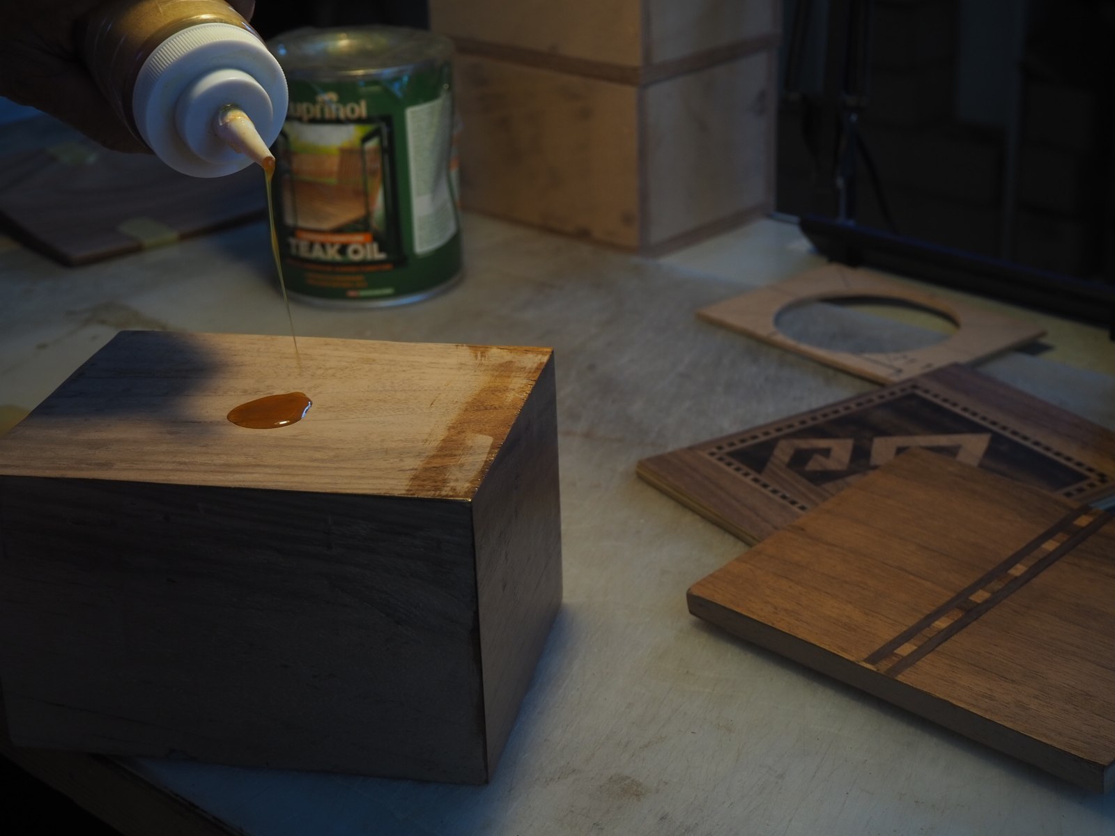 Hand-finishing the winder box with teak oil